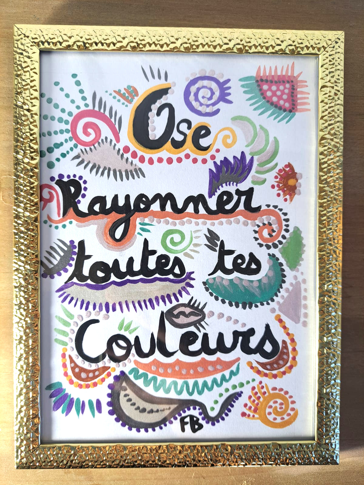 Positive quote "Dare to shine in all your colors" frame to put down.
